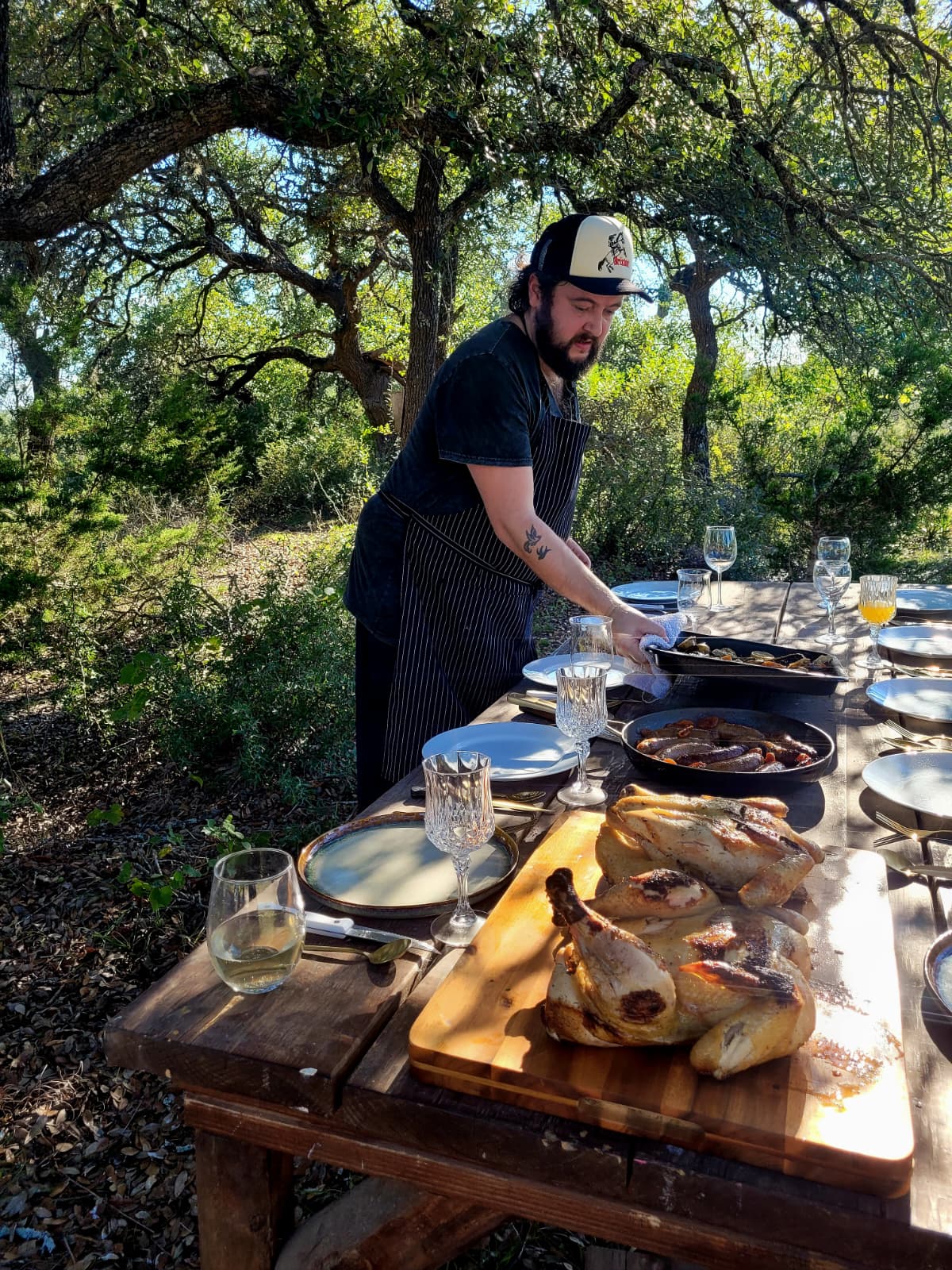 Alfie Milner serving the feast at the long table